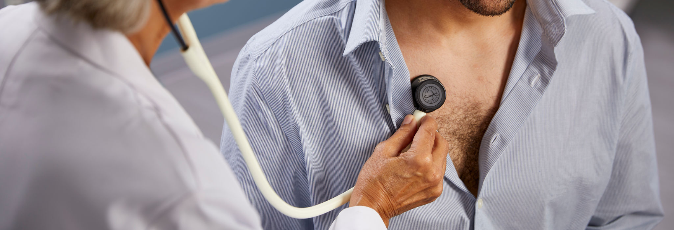 Healthcare provider examining patient with stethoscope